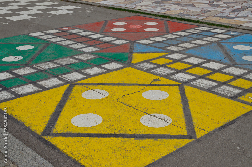 Hopscotch court with numbers from 1 to 9 drawn with paint on the asphalt