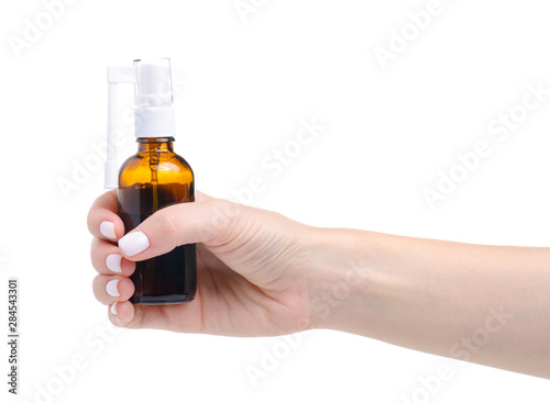 Throat spray medicine in hand on white background isolation