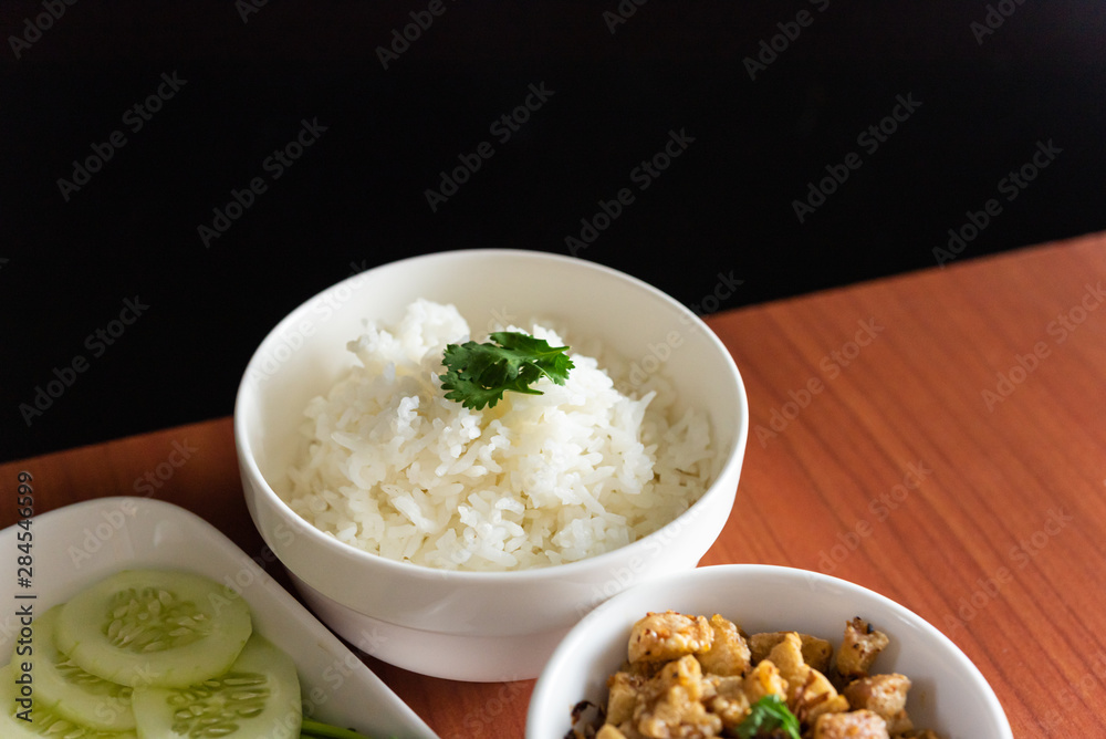 Thai cuisine, Northern of Thailand Lanna style, Hot steamed rice with crispy belly pork in chili flavor and fresh vegetables, space for text Thai cuisine, Northern of Thailand Lanna style, Hot steamed rice with crispy belly pork in chili flavor and fresh vegetables, space for text