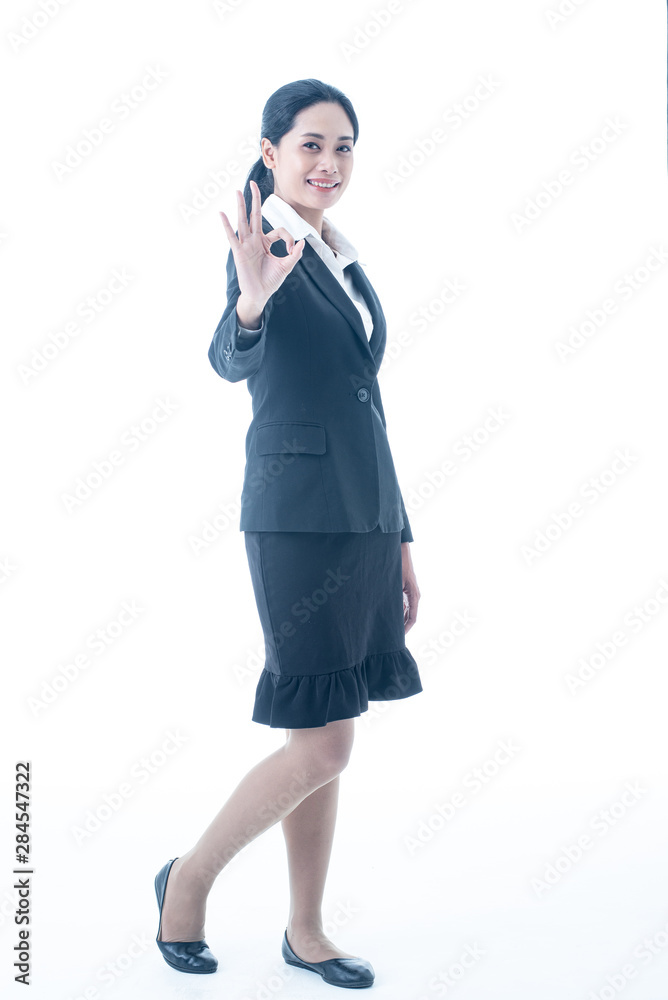 Asian beautiful smart and young businesswoman with black long hair and suit is the executive or manager stand up thinking and smiling with confidence in successful on isolated white background Asian beautiful smart and young businesswoman with black long hair and suit is the executive or manager stand up thinking and smiling with confidence in successful on isolated white background