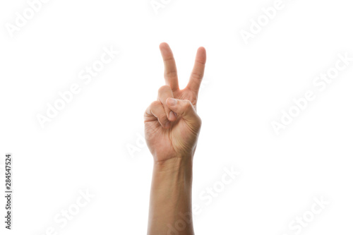 Hand shows two fingers, greeting gesture.