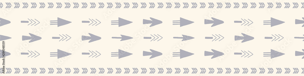 Seamless border of arrows in one direction design. A hand drawn vector pattern in cream and grey. Seamless border of arrows in one direction design. A hand drawn vector pattern in cream and grey.