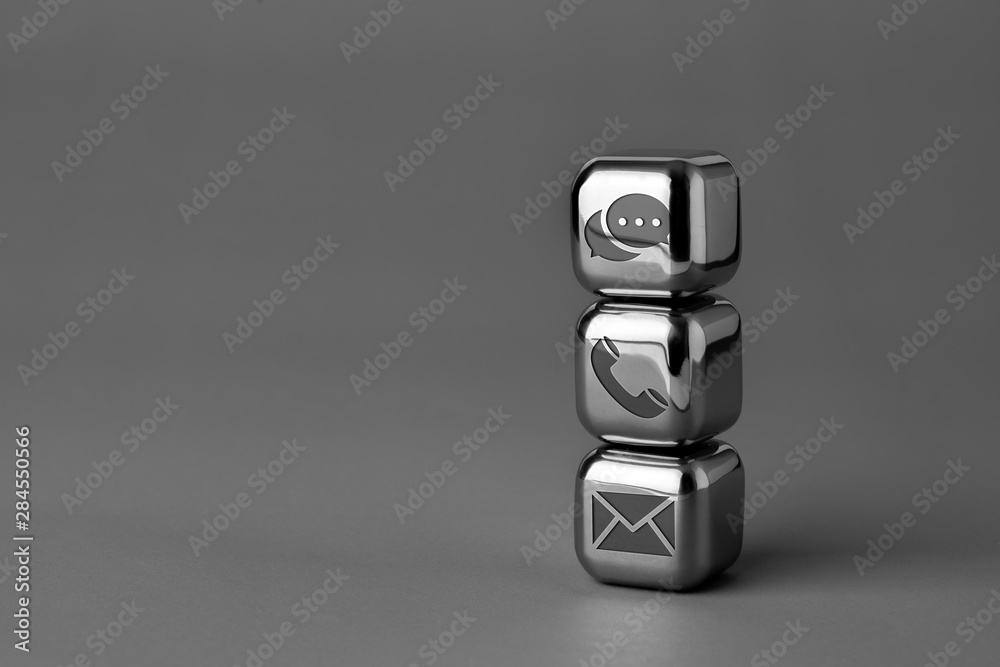 Contact us icon on metal cube for futuristic style Contact us icon on metal cube for futuristic style