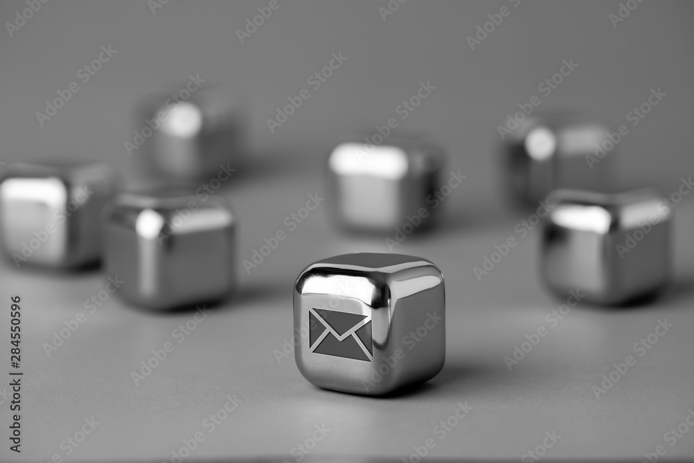 Contact us icon on metal cube for futuristic style Contact us icon on metal cube for futuristic style