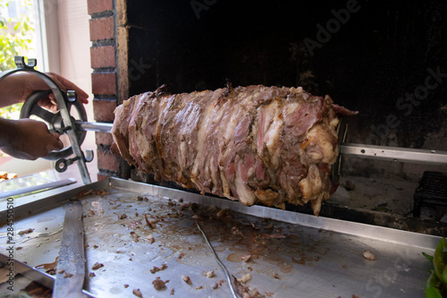 Chef prepares a traditional Turkish cag kebab at an open restaurant in Istanbul.Cag kebab is looks like doner kebab,but it is put front the fire horizontal photo