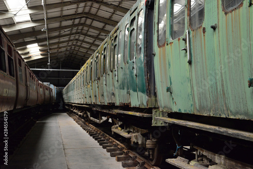 Rotten Railway carriages in a warehouse in the UK.