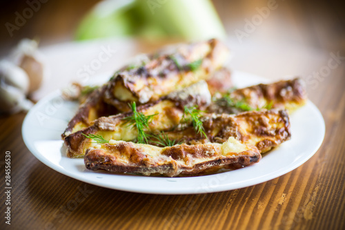 oven-baked zucchini in batter with garlic and herbs
