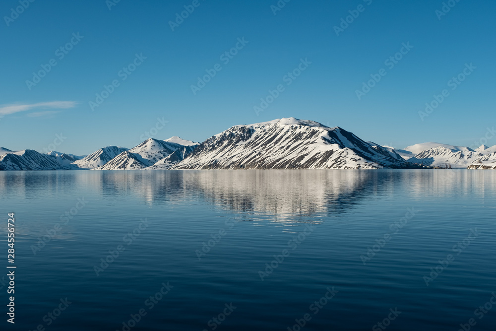 The mountainous sea coast is covered with snow. The mountainous sea coast is covered with snow.