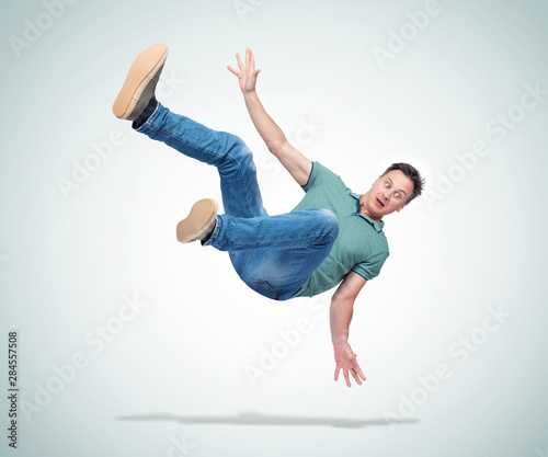 Fotografie Situation, the man in casual clothes is falling