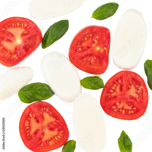 Mozzarella  tomatoes  and basil on white background  top view