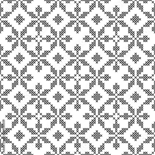 Cross-stitch, embroidery. Black and white seamless decorative pattern. Ornamented background for wallpaper, textile.