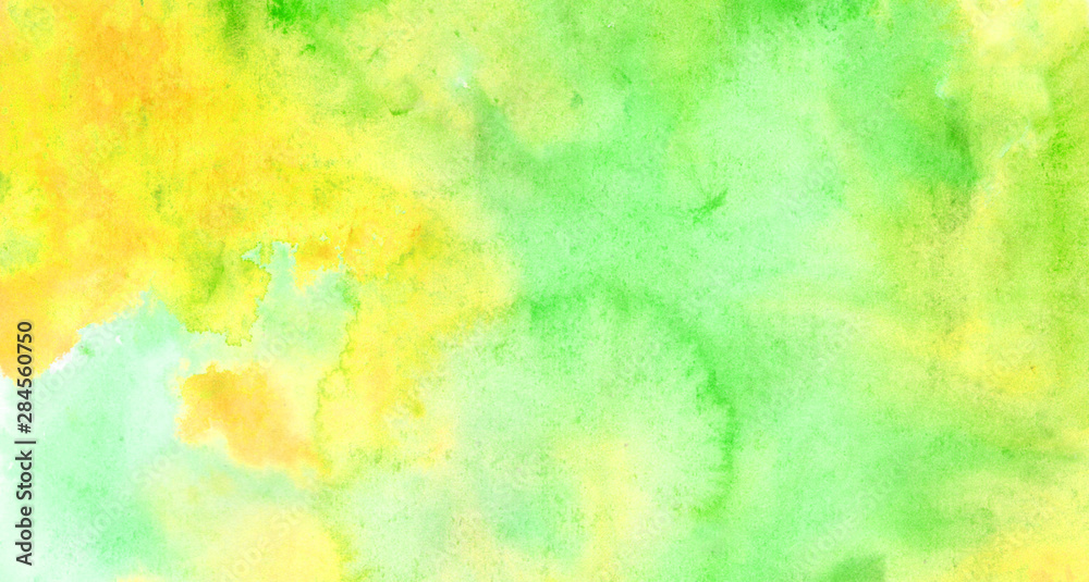 Beautiful abstract smudges of yellow green and aqua colors in hand painted watercolor background design