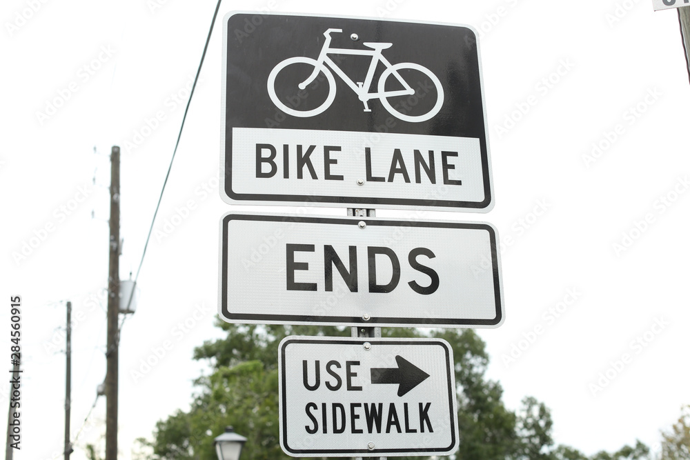 black and white bike lane sign