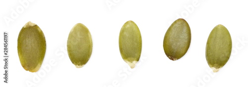 Set pumpkin seeds macro isolated on white background, top view 