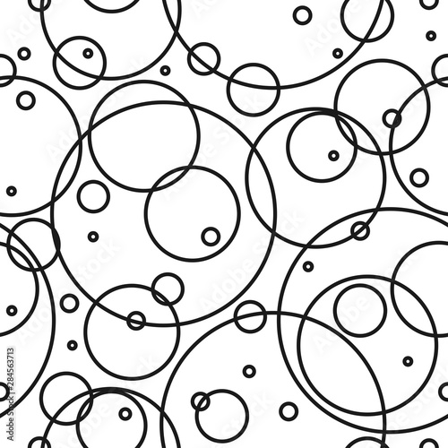 Seamless abstract pattern with black empty overlapping circles of different size.