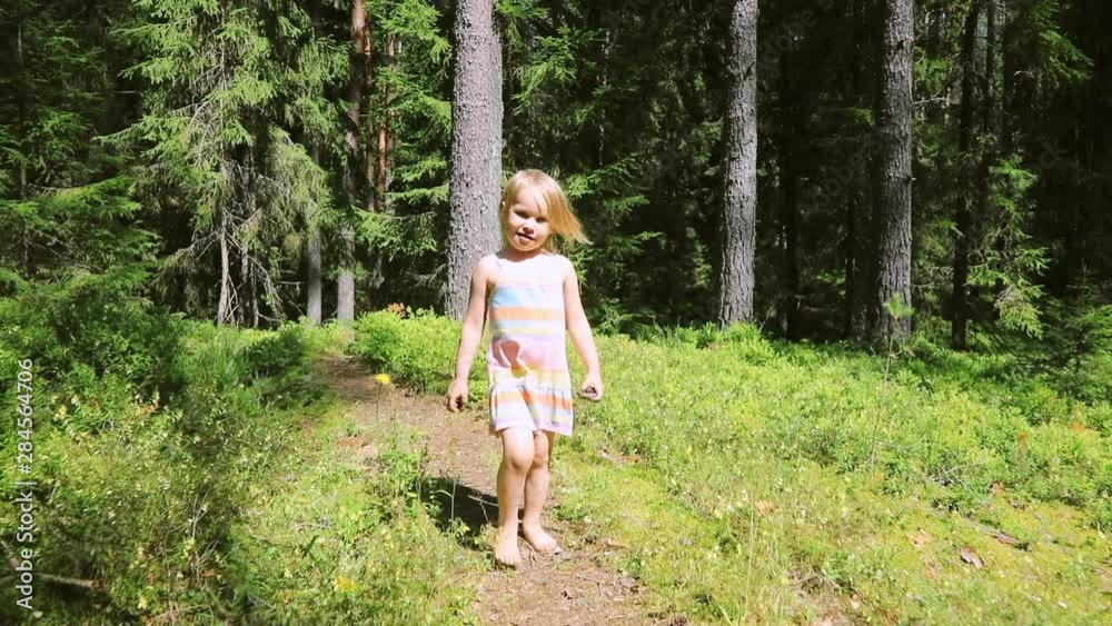 Little girl walking on footpath in a summer forest_0301 Little girl walking on footpath in a summer forest_0301