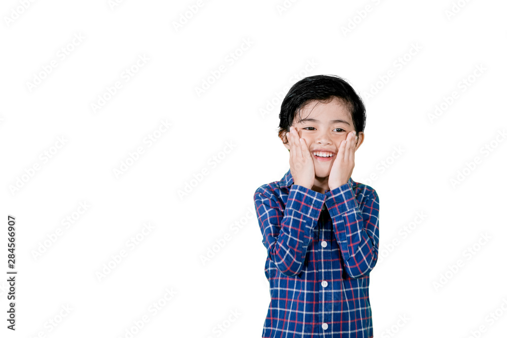 Cute little boy showing surprised face on studio Cute little boy showing surprised face on studio