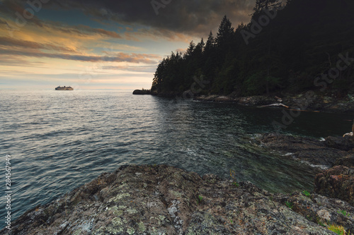 Sunset colours and rocky beaches with bluffs and cliffs in Apodaca Provincial Park on Bowen Island.  British Columbia Canada. Close to Vancouver. photo