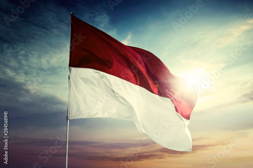Indonesia flag waving in the wind at dawning time © Creativa Images