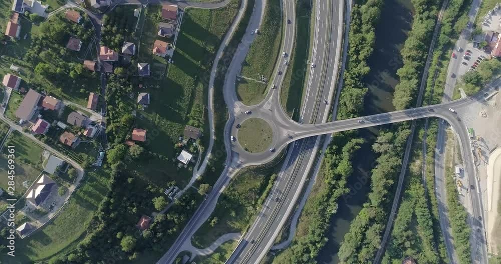 Aerial view of highway and overpass in city. Aerial view roundabout interchange of a city. Expressway is an important infrastructure. Aerial view of highway and overpass in city. Aerial view roundabout interchange of a city. Expressway is an important infrastructure.