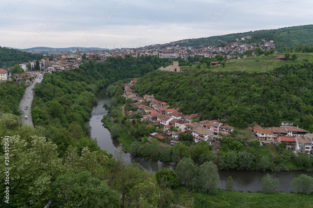 Panoramic view of Veliko Tarnovo old town, Yantra river and View to tower and Trapezitsa fortress. Bulgaria