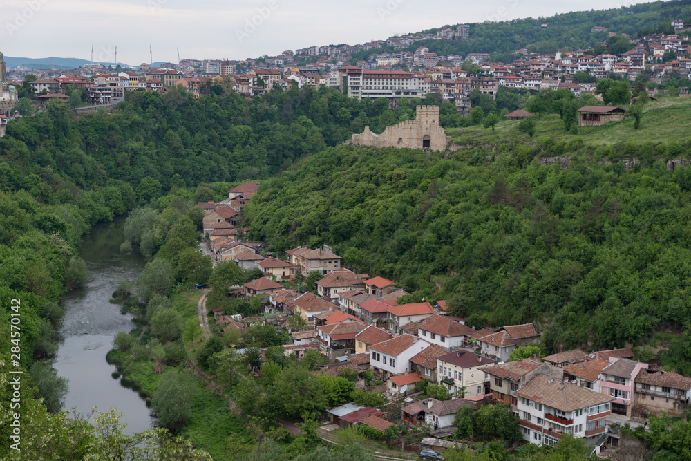 Panoramic view of Veliko Tarnovo old town, Yantra river and View to tower and Trapezitsa fortress. Bulgaria