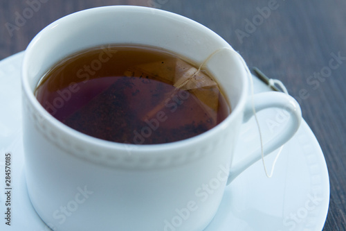 cup and saucer full of hot tea