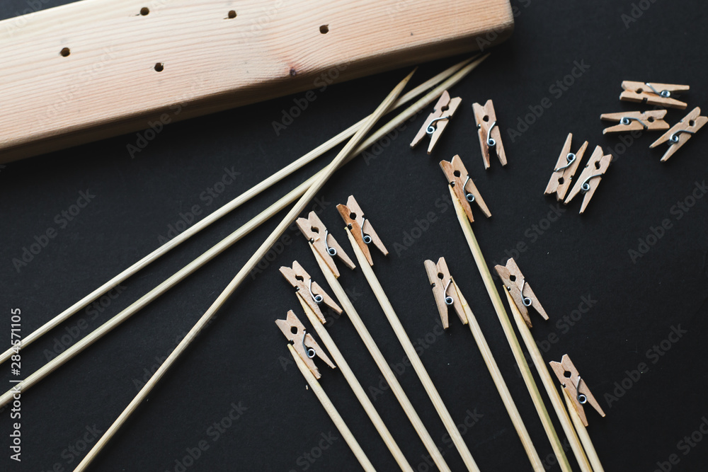glue together wooden clothespins and sticks, make a holder for photos glue together wooden clothespins and sticks, make a holder for photos