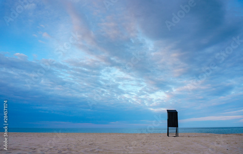 Single black wooden lifegurd tower on an empty beach on the Black Sea coast of Bulgaria - minimaliist and scandinavian compisition with a feel for solitude