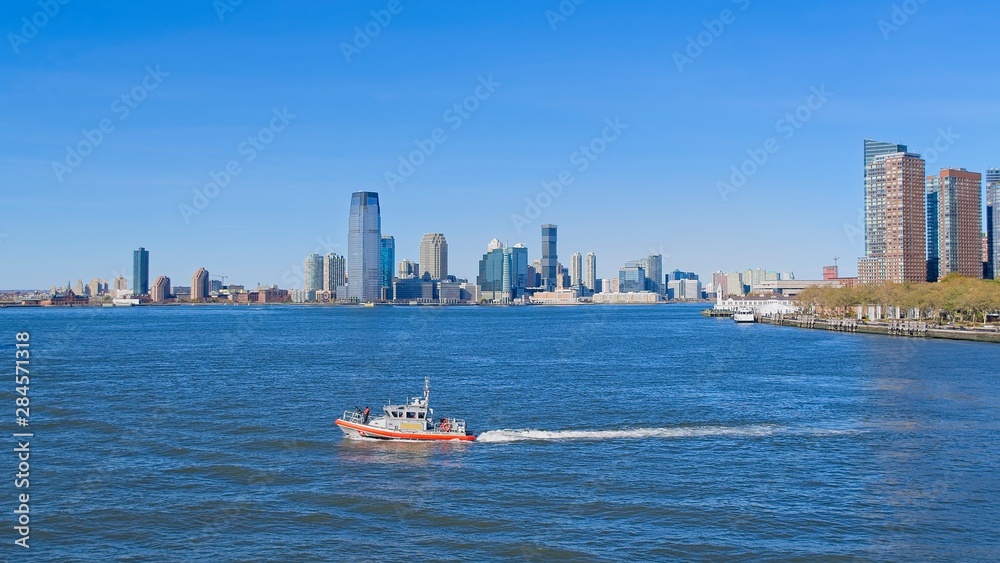 New Jersey skyline from Hudson River with a ship in the foreground