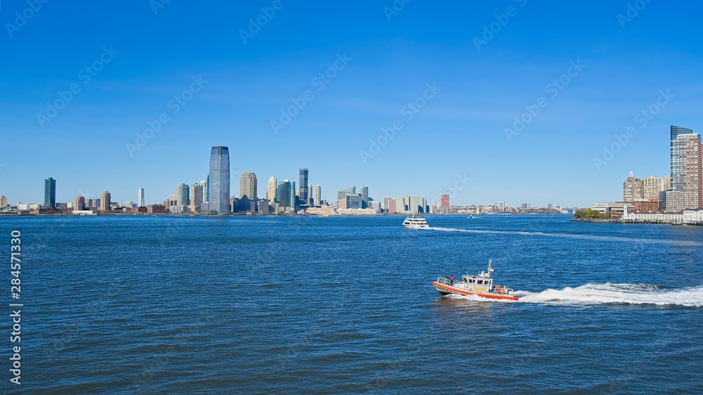 New Jersey skyline from Hudson River with a ship in the foreground