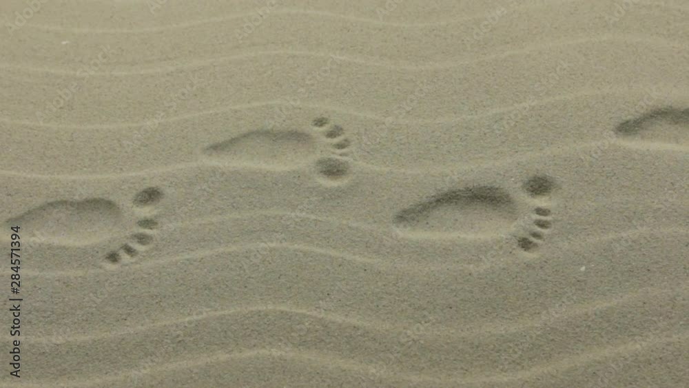 Slider shot, stylized human footprints. Imprint of human footprints Slider shot, stylized human footprints. Imprint of human footprints