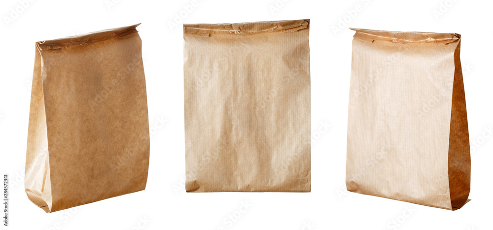 Set of new empty blank paper bag without inscriptions and logos. Made from brown kraft paper. Isolated on white background.