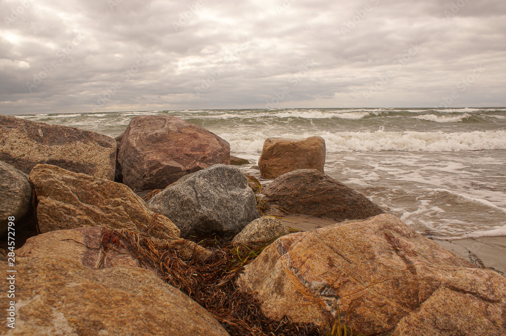 rocks on beach at sunset rocks on beach at sunset