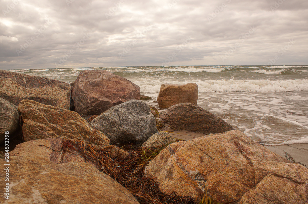 rocks on beach at sunset