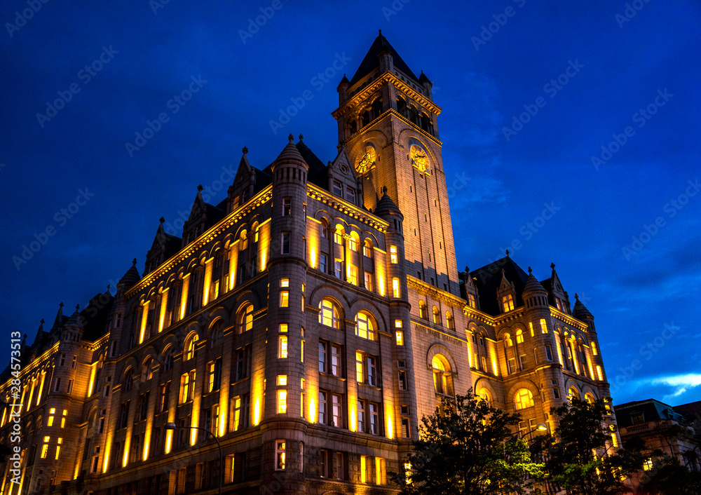 Fototapeta premium Illuminated Old Post Office Building Evening Washington DC