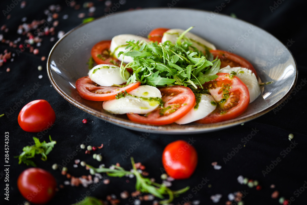 italian caprese salad with fresh mozzarella, tomatoes & basil italian caprese salad with fresh mozzarella, tomatoes & basil