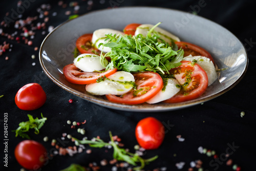 italian caprese salad with fresh mozzarella, tomatoes & basil