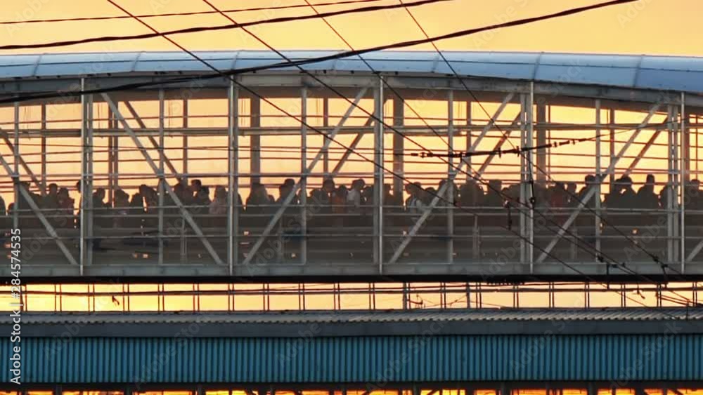 Crowd people walk in crowded city bridge on street at rush hour with sunset 4K Crowd people walk in crowded city bridge on street at rush hour with sunset 4K