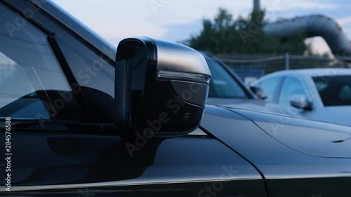 Side rear-view mirror on a modern car.