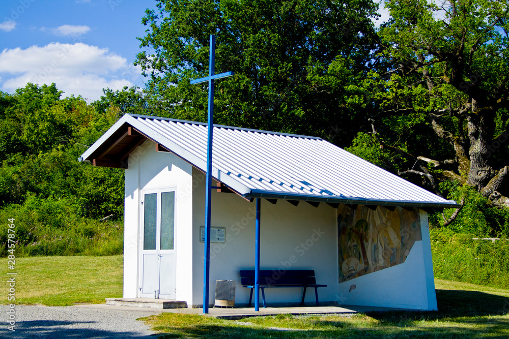 A small white chapel at a highway in Bavaria, Germany A small white chapel at a highway in Bavaria, Germany