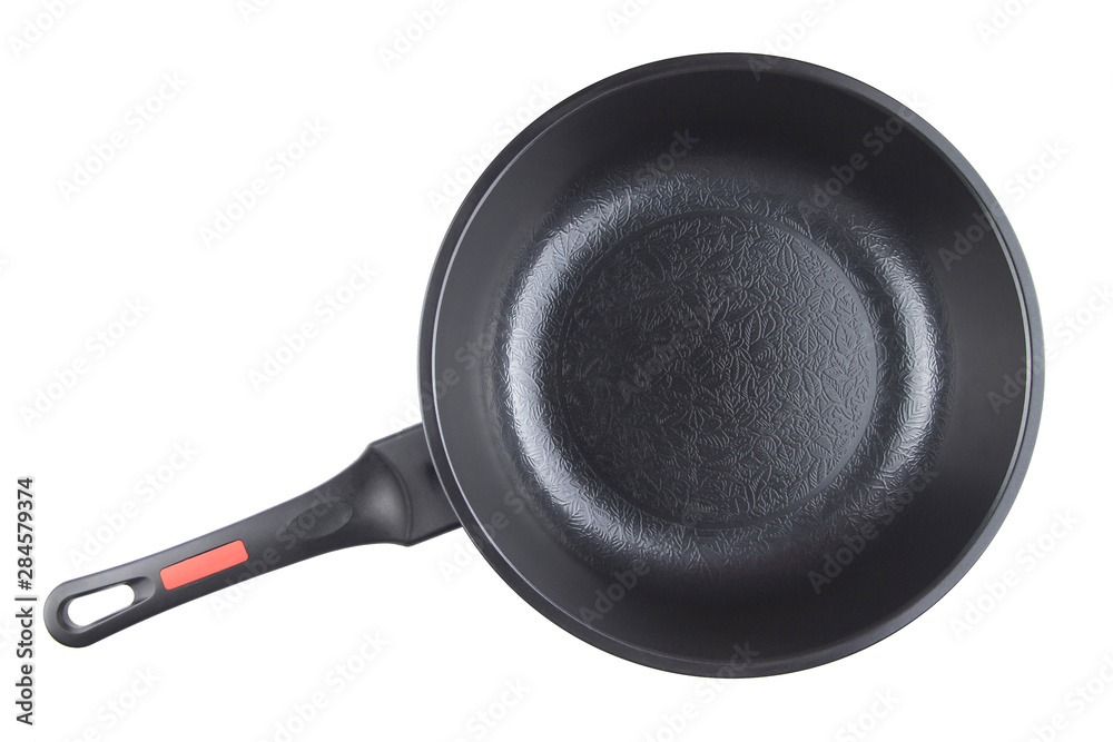 Black frying pan with nonstick surface isolated on white background, closeup, top view. Black frying pan with nonstick surface isolated on white background, closeup, top view.