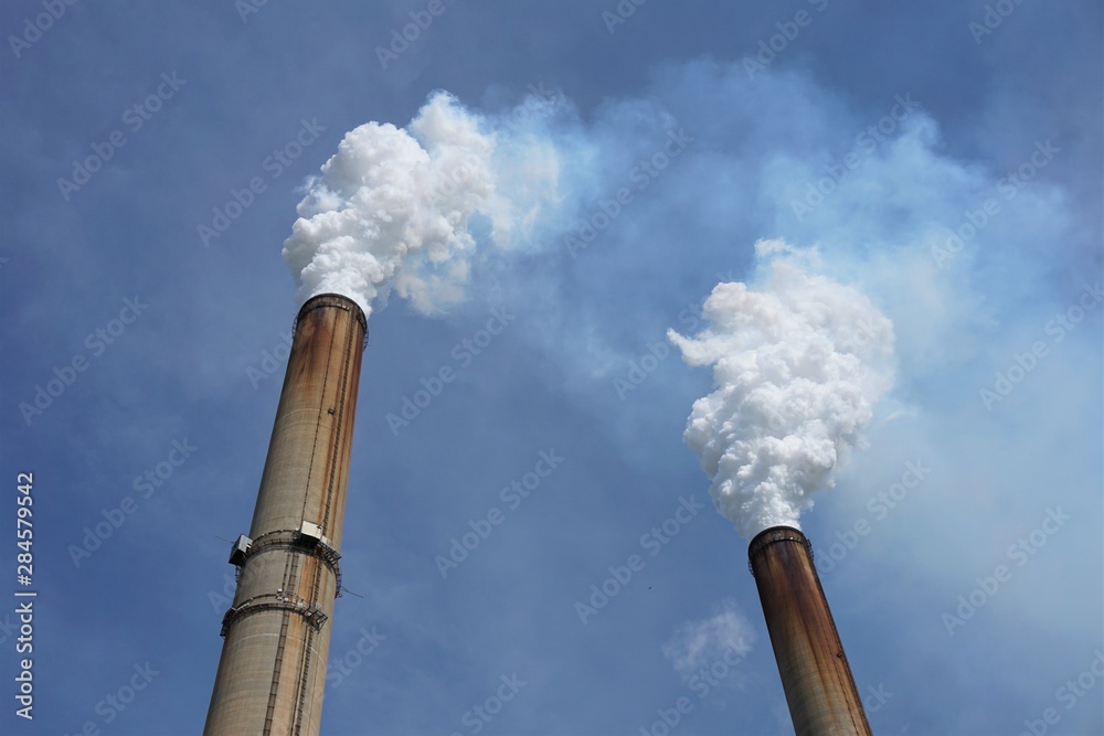 Smoke stacks from a coal-burning power plant - vertical Smoke stacks from a coal-burning power plant - vertical