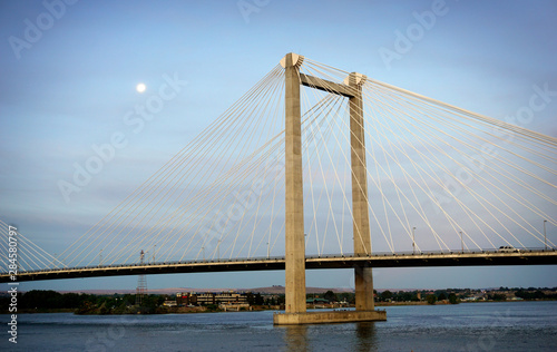 Cable susoension bridge over Columbia river at dawn with moon in sky © jdoms