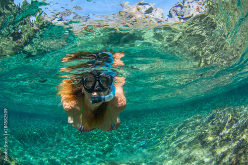 Woman snorkeling in the sea at Tenerife Canary Islands Spain