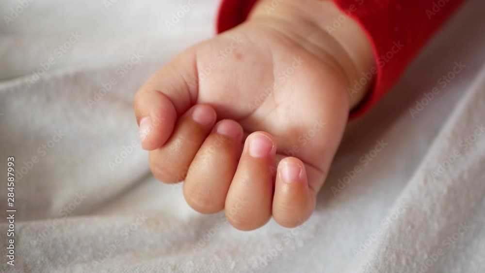 Hand of a newborn. Newborn children's hand in mother hand. Mom and her Child. Happy Family concept. Beautiful conceptual image of Maternity. Hand of a newborn. Newborn children's hand in mother hand. Mom and her Child. Happy Family concept. Beautiful conceptual image of Maternity.