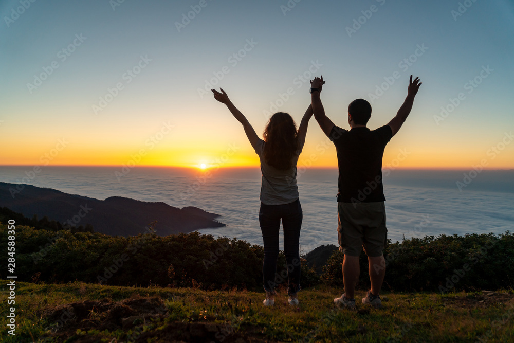 Couple looking at the beautiful sunset from Gomismta mountain, Georgia. Couple looking at the beautiful sunset from Gomismta mountain, Georgia.