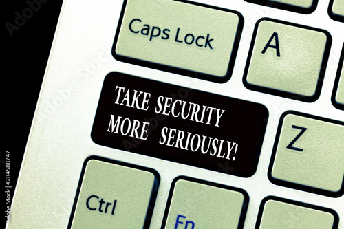 Word writing text Take Security More Seriously. Business concept for Be alert and aware of possible hacking attacks Keyboard key Intention to create computer message, pressing keypad idea photo