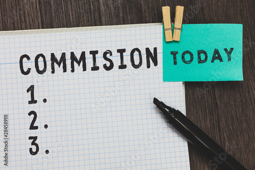 Writing note showing Commision. Business photo showcasing instruction comanalysisd or role given to demonstrating or group got paid Open notebook page pins holding reminder marker wooden background photo