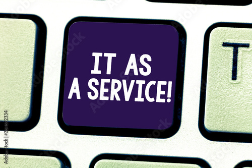 Word writing text It As A Service. Business concept for Information technology giving services to business Keyboard key Intention to create computer message pressing keypad idea photo